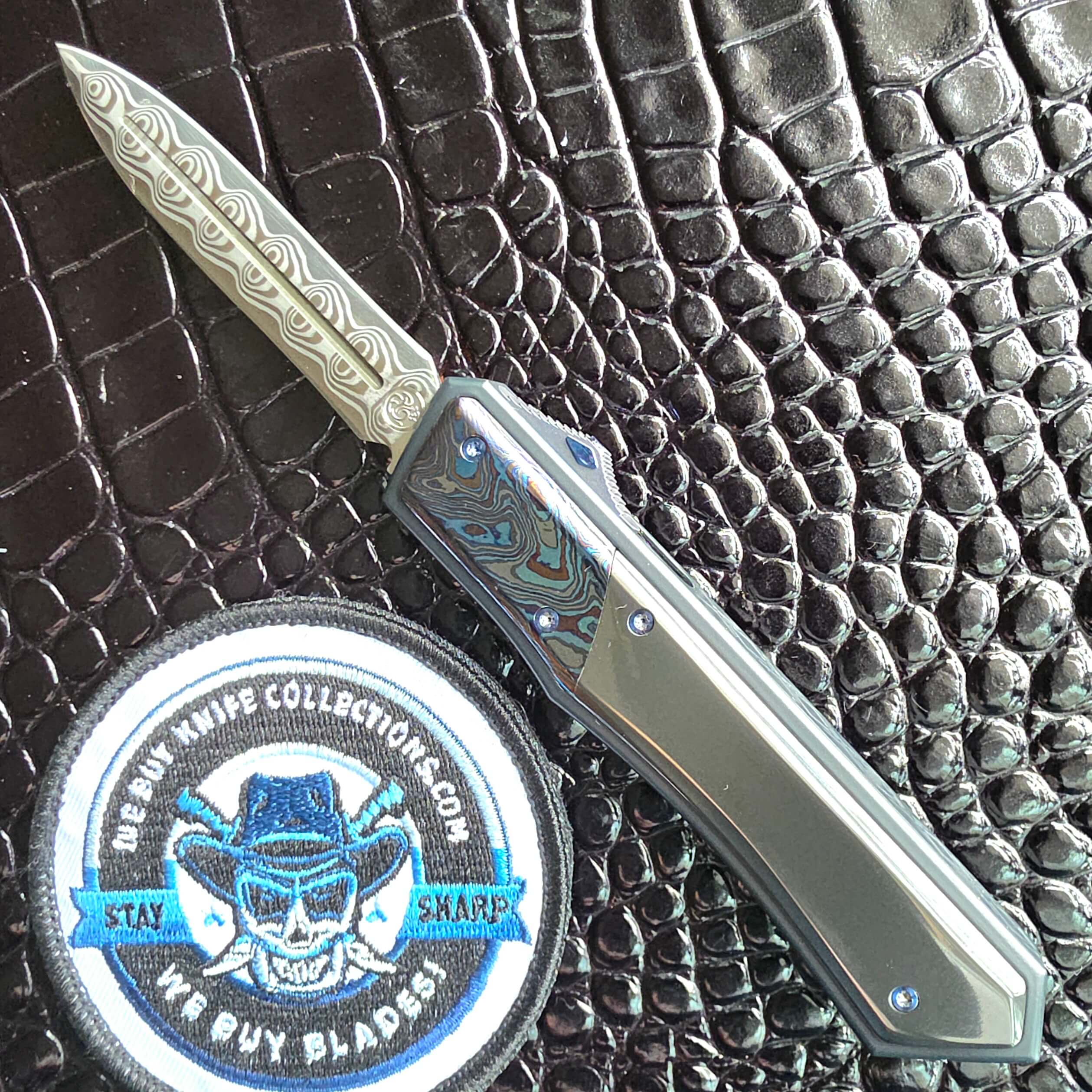 Patrick Famin G.O.T.F. Mini — Damasteel Damacore Dagger, Black Timascus Bolsters, Zirconium Scales, D/A OTF Automatic